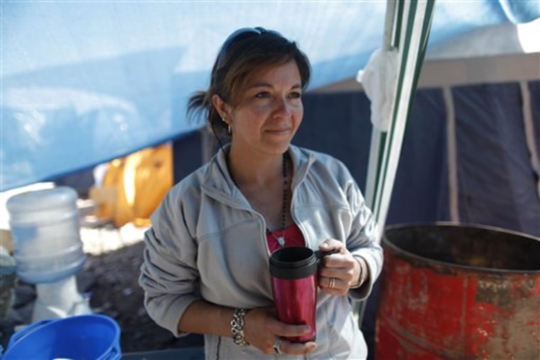 Carola Narvaez, wife of miner Raul Bustos, is camped out with other miners' relatives at the mine near Copiaop, Chile.